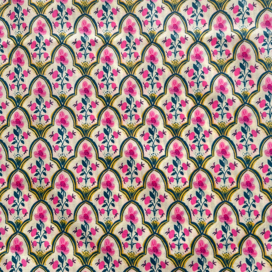 Decorative fabric pattern with pink flowers and green leaves on a white beeswax wrap
