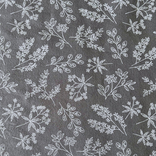 White floral pattern on a gray reusable beeswax food wrap