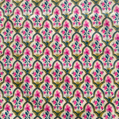 Decorative fabric pattern with pink flowers and green leaves on a white beeswax wrap