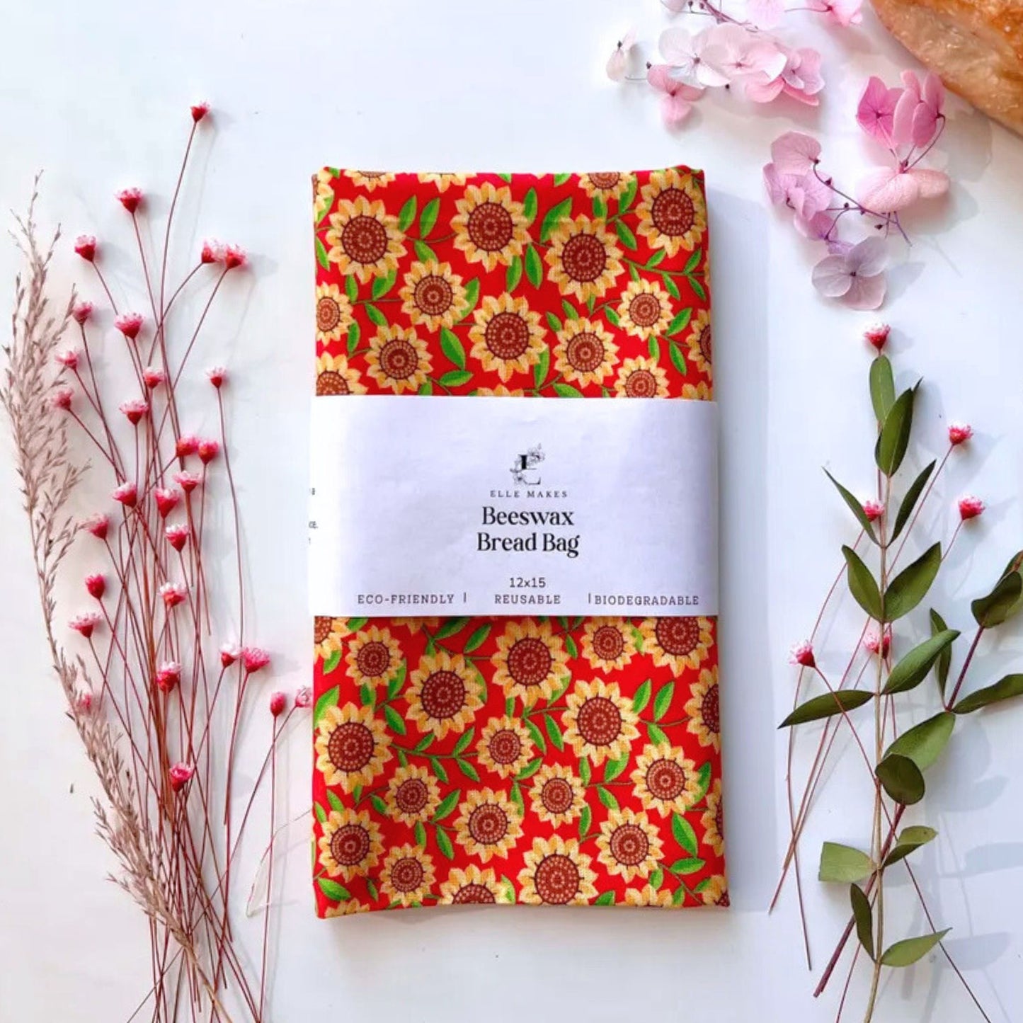 Beeswax bread bag with sunflower design on a red cotton fabric