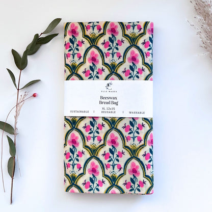 White beeswax bread bag with a pink floral pattern.