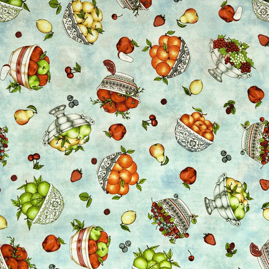 Pattern of bright apples, pears,, cherries, on a light blue beeswax wrap