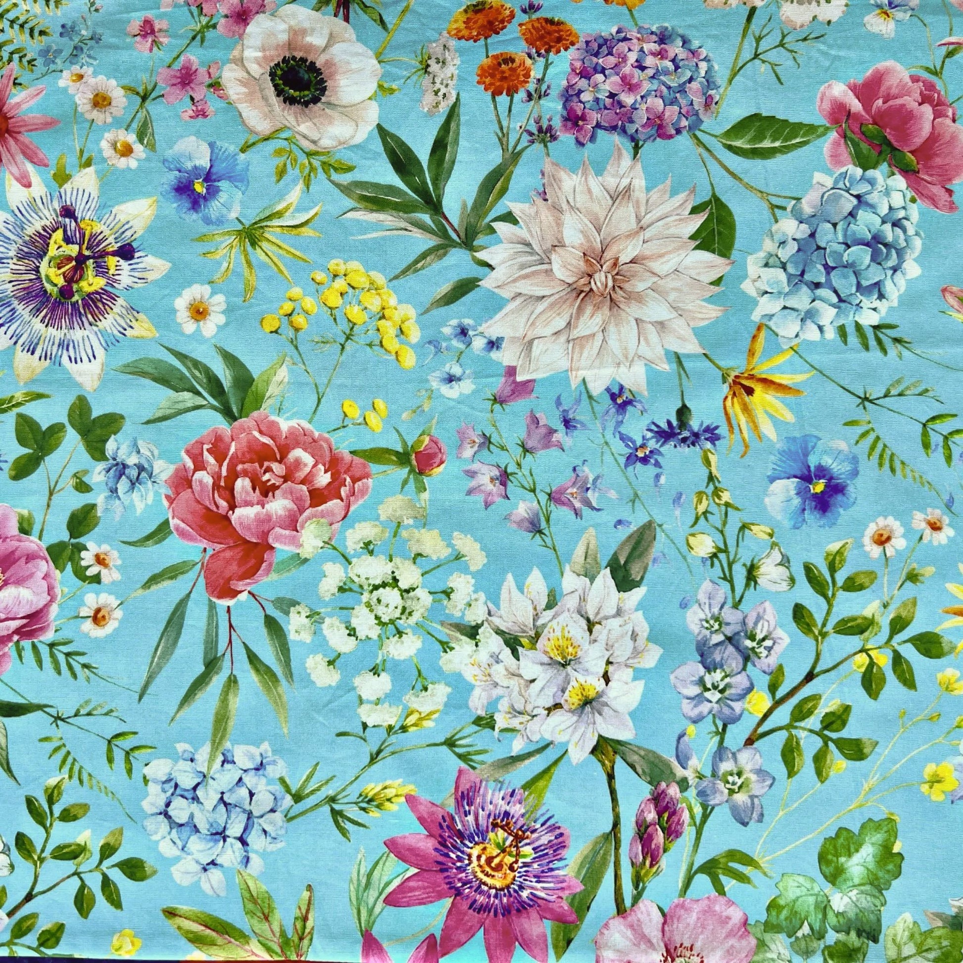 Colorful hydrangea floral pattern on a blue beeswax wrap