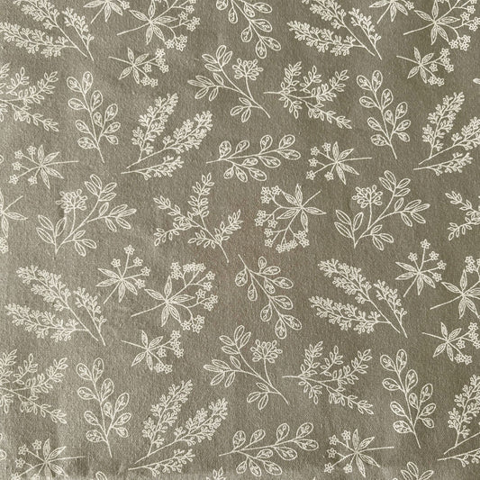 Pattern of white leaves on a grey fabric beeswax wrap