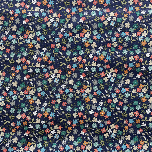 Navy blue beeswax food wrap with small multicolored floral pattern