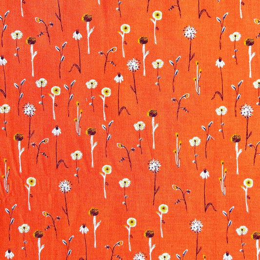 simple white floral pattern on an orange beeswax wrap