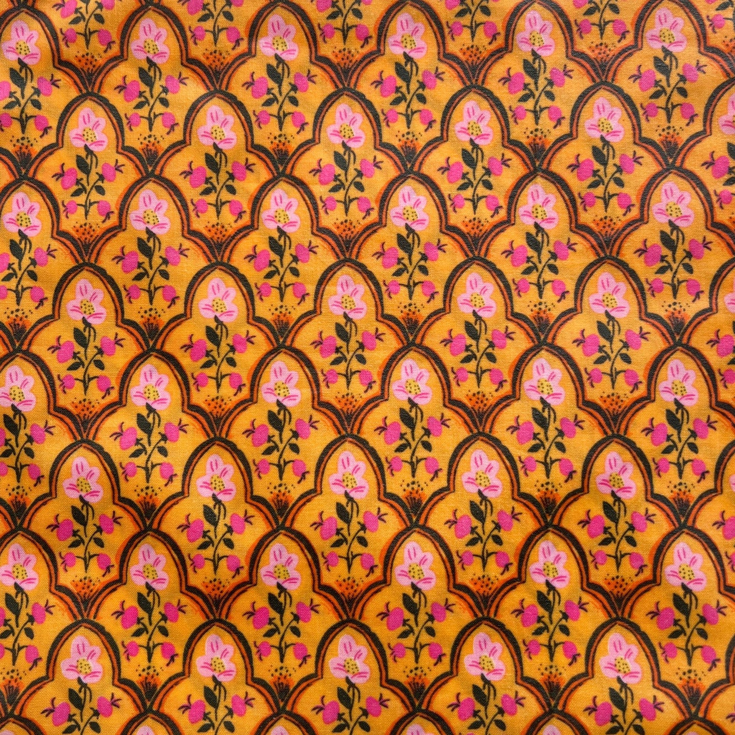 simple pink floral design on a orange beeswax wrap