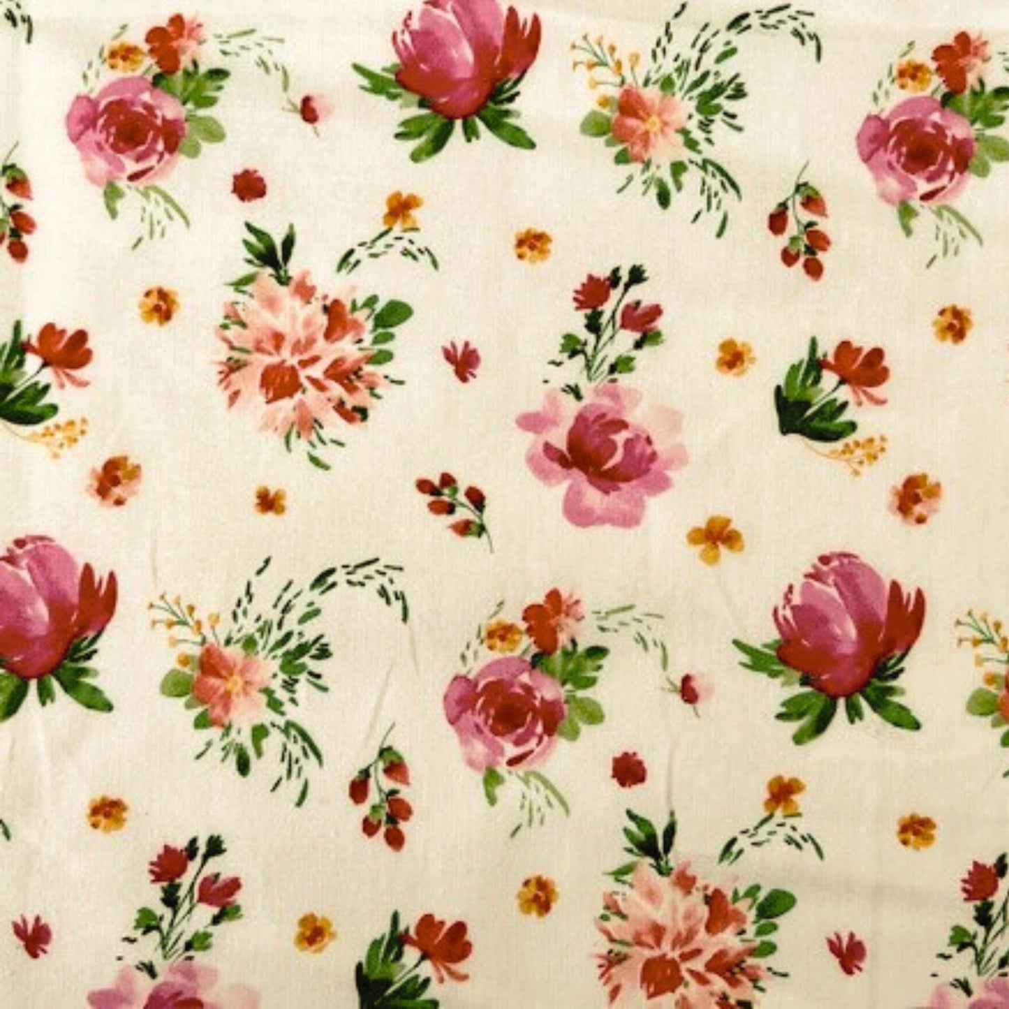 Floral pattern with pink and red flowers on a white beeswax wrap