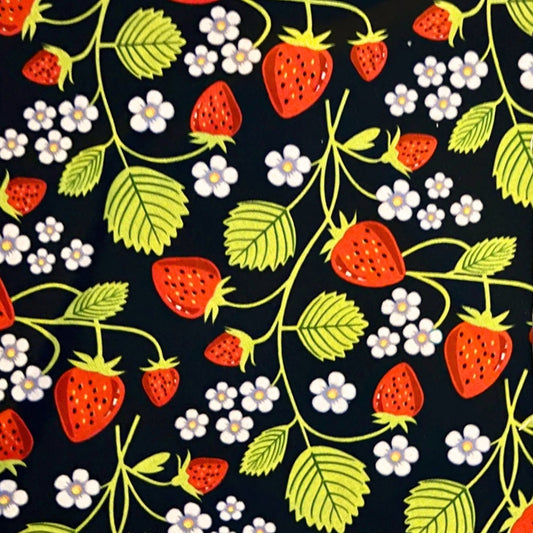 Pattern of strawberries, leaves, and flowers on a beeswax wrap
