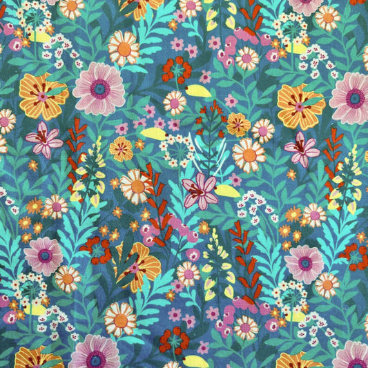 Colorful floral and jungle vibe pattern on a blue beeswax wrap